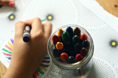 child coloring in daycare