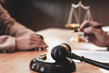 gavel with ring and divorce lawyer in background