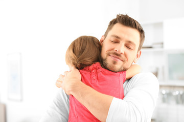 dad hugging daughter