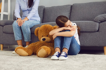 parent and child sad on couch