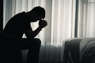 silhouette of sad man