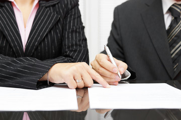 divorcing couple signing papers