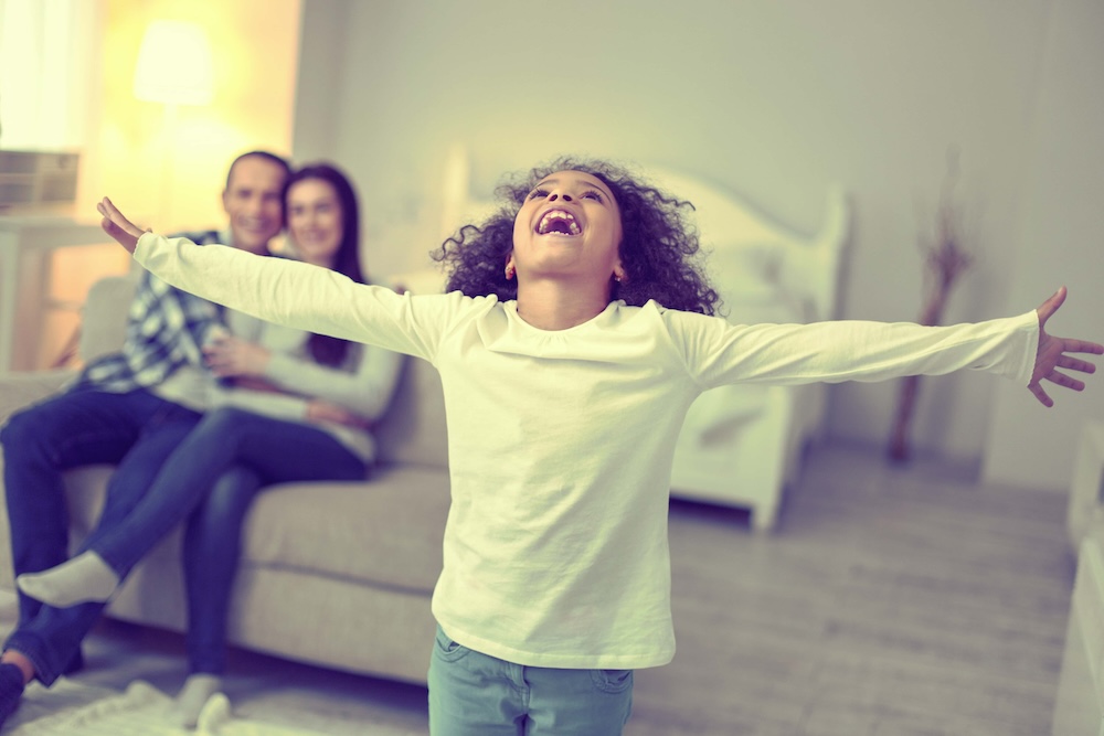 Ardent excited kid letting out a cry of enthusiasm