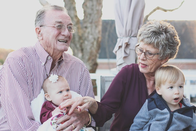 grandparents with two babies