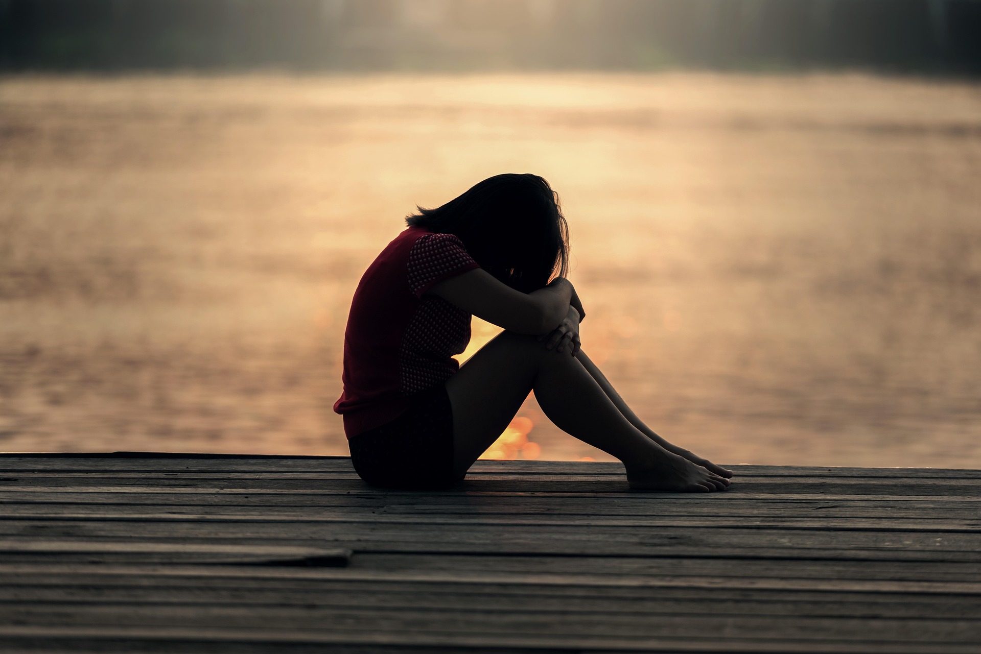 sad woman on dock