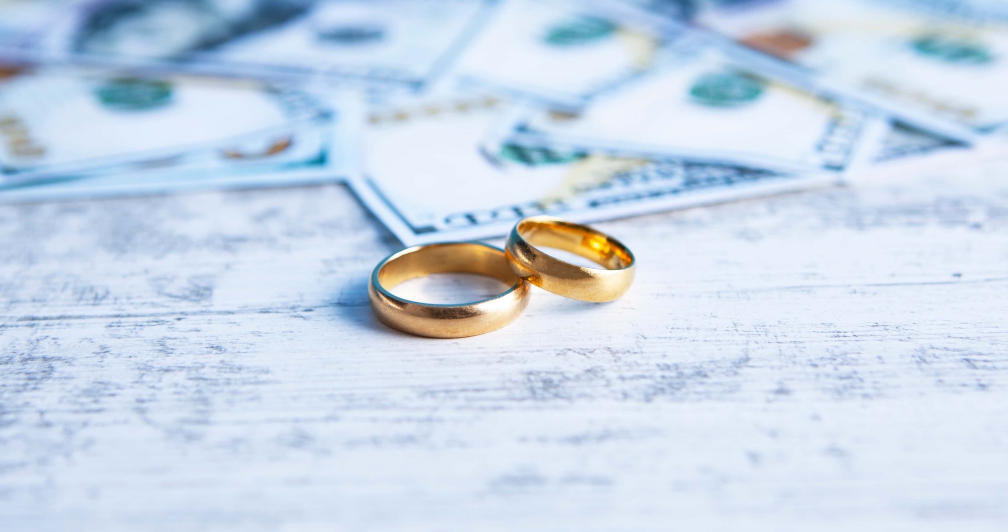 wedding rings sitting table with money